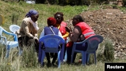 Red Cross officials offer counseling services to parents of pupils of the Hillside Endarasha Academy, after a fatal fire outside the school, in Kieni, Nyeri County, Kenya, Sept. 7, 2024.