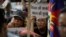 Exile Tibetans listen to a speaker during a protest to show support with India's Doklam standoff in New Delhi, India, Aug. 11, 2017.