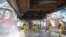 Employees of the Federal State Center for Special Risk Rescue Operations of Russia Emergency Situations disinfect a platform of Leningradsky railway station in Moscow, Russia, May 19, 2020. 