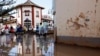 Volunteers clean up around a marketplace affected by flooding in Catarroja, Valencia, Spain, Nov. 11, 2024.