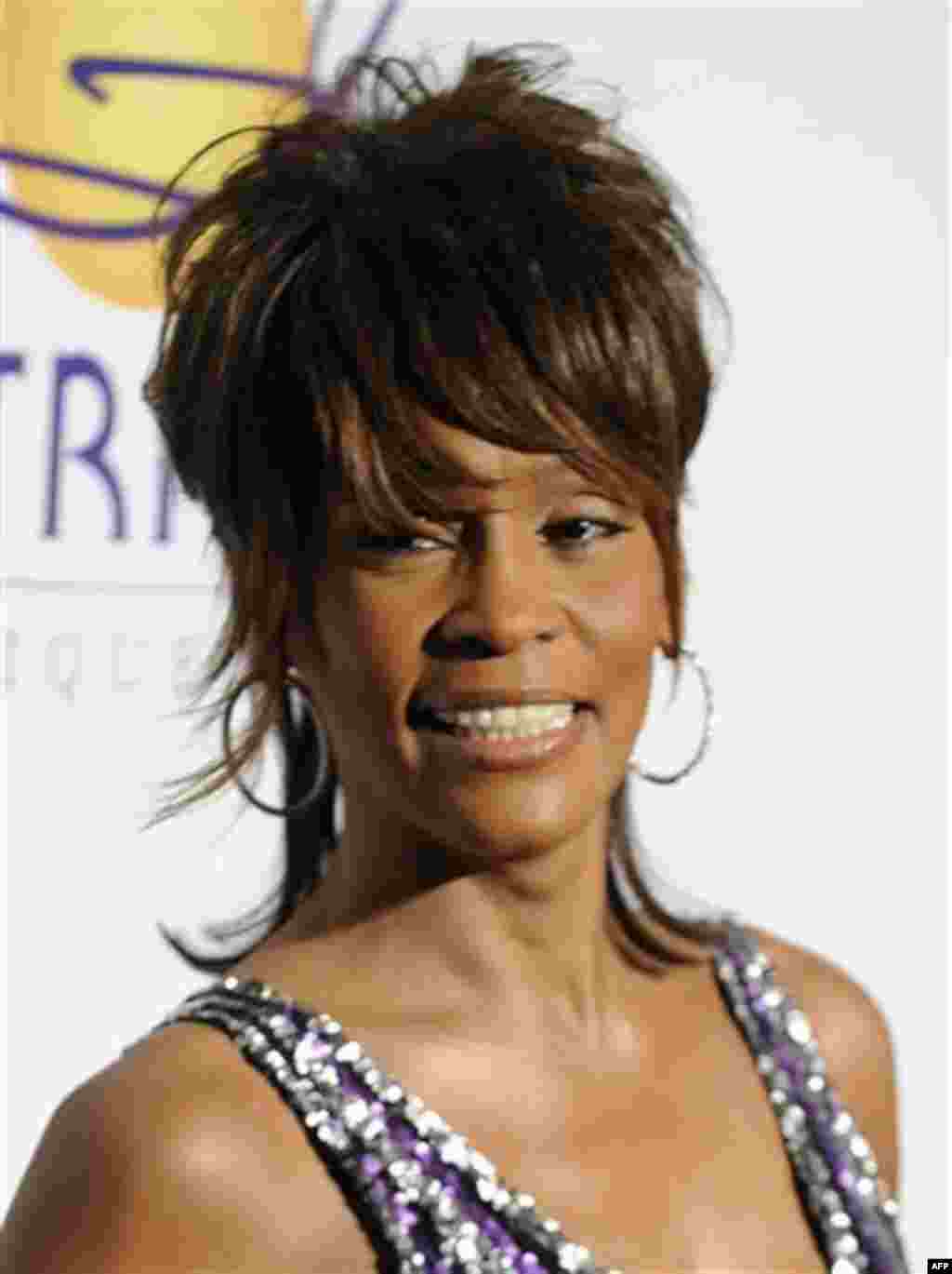 FILE - In this Feb. 9, 2008 file photo, singer Whitney Houston arrives at the Clive Davis Pre-Grammy Party in Beverly Hills, Calif. Whitney Houston, who reigned as pop music's queen until her majestic voice and regal image were ravaged by drug use, has d