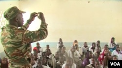 A Cameroonian soldier teaches children at a government school in Fotokol, May 11, 2018. (M. Kindzeka/VOA)