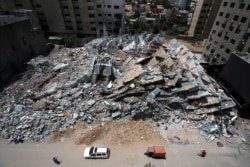 The remains of a tower building are seen after being destroyed by Israeli missile strikes in the recent cross-border violence between Palestinian militants and Israel, in Gaza City, May 21, 2021.