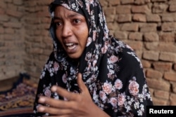 FILE -Fatma, daughter of Tarek Bahreldin, recounts how her family tried to retrieve the body of her slain father, in Adre, Chad August 6, 2023.