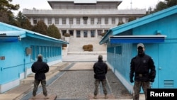 South Korean soldiers stand guard during a media tour at the Joint Security Area (JSA) on the Demilitarized Zone in the border village of Panmunjom in Paju, South Korea, March 3, 2023. 