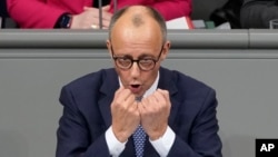 Opposition leader Friedrich Merz of the CDU party speaks during a plenary session at the German parliament Bundestag, in Berlin, Germany, Dec. 16, 2024.