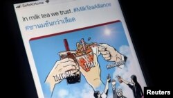 FILE - A mobile phone displays an internet meme of a growing online movement called "Milk Tea Alliance" to show solidarity between Thailand, Taiwan and Hong Kong, in this illustration photo, taken April 15, 2020. 