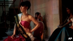 FILE - In this Nov. 11, 2016, photo, contestants wait backstage during the Miss Transgender Indonesia pageant in Jakarta, Indonesia. 