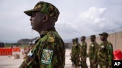 FILE - Kenyan members of the Multinational Security Support Mission stand at attention in Port-au-Prince, Haiti, on Sept. 5, 2024.