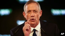 FILE - Retired Israeli military chief Benny Gantz speaks at the official launch of his election campaign for the April 2019 polls, in Tel Aviv, Jan. 29, 2019.