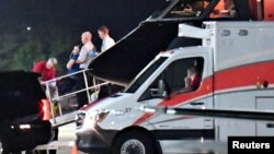 A person believed to be Otto Warmbier is transferred from a medical transport airplane to an awaiting ambulance at Lunken Airport in Cincinnati, Ohio, U.S., June 13, 2017. 