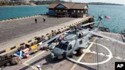 A helicopter parks on a USS Gary warship docked at Sihanoukville port some 185 kilometers (115 miles) southwest of capital Phnom Penh, file photo. 