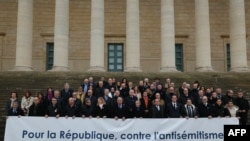FILE —Chief Rabbi of France Haim Korsia, Bishop of Nanterre monseigneur Matthieu Rouge, former President Nicolas Sarkozy, Prime Minister Elisabeth Borne, former French President Francois Hollande and the heads of parliament at the Assemblee Nationale in Paris, November 12, 2023