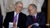 FILE - Senate Majority Leader Mitch McConnell, left, and Senate Minority Leader Chuck Schumer talk during a Capitol Hill ceremony in Washington, Oct. 25, 2017.