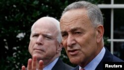 U.S. Senators Charles Schumer (D-NY), right, and John McCain (R-AZ), address media after White House immigration meetings, July 11, 2013.