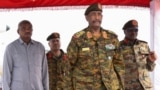 FILE - Sudan's General Abdel Fattah al-Burhan after landing in the military airport of Port Sudan on his first trip away following the crisis in Sudan's capital Khartoum since an internal conflict broke out, in the city of Port Sudan, Sudan, August 27, 2023.