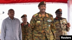 FILE - Sudan's General Abdel Fattah al-Burhan after landing in the military airport of Port Sudan on his first trip away following the crisis in Sudan's capital Khartoum since an internal conflict broke out, in the city of Port Sudan, Sudan, August 27, 2023.