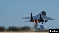 FILE - A Republic of Korea Air Force F-15K Slam Eagles fighter plane takes off during Exercise Max Thunder 17 at Gunsan Air Base, South Korea, April 27, 2017. 