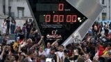 People photograph the countdown clock at Trafalgar Square in downtown London prior to the Opening Ceremony of the 2012 Summer Olympics, July 27, 2012, in London. 
