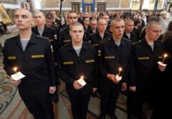 Navy sailors attend a religion service to commemorate the crew members that were killed on one of the Russian navy's deep-sea research submersibles at Kronshtadt Navy Cathedral outside St. Petersburg, Russia, July 4, 2019.