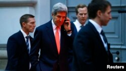 U.S. Secretary of State John Kerry makes a phonecall after a meeting in Vienna, Nov. 21, 2014.