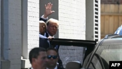 Former U.S. President and Republican presidential candidate Donald Trump waves as he departs the Capitol Hill Club following a meeting with Republicans from the U.S. House of Representatives on Capitol Hill in Washington on June 13, 2024.