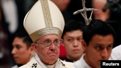 Pope Francis celebrates a mass for the Virgin of Guadalupe in Saint Peter's Basilica at the Vatican, Dec. 12, 2014. 