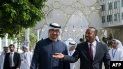 FILE — This photo provided by the UAE Presidential Court shows UAE President Sheikh Mohamed bin Zayed al-Nahyan and Ethiopia's Prime Minister Abiy Ahmed Ali touring the EXPO city during the COP28 United Nations climate summit in Dubai on November 30, 2023.