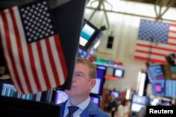 A trader works on the trading floor at the New York Stock Exchange (NYSE) in New York City, Sept. 3, 2019.
