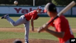 In this June 23, 2017 photo, pitcher Eric Pardinho throws a pitch during practice in Ibiuna, Brazil.