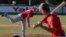 In this June 23, 2017 photo, pitcher Eric Pardinho throws a pitch during practice in Ibiuna, Brazil.