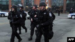 Police on School and Walnut Street as the search continues for a suspect on April 19, 2013 in Watertown, Massachusetts.