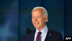 US President Joe Biden does a stage check before the start of the first day of the Democratic National Convention (DNC) at the United Center in Chicago, Illinois, on August 19, 2024.