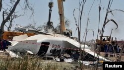 The wreckage of a plane that crashed, killing people as it was heading to the capital Juba, at the Unity oilfield airport, Unity State, South Sudan, Jan. 29, 2025. 