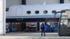 A law enforcement officer walks to an aircraft carrying former Philippine President Rodrigo Duterte after its arrival at Rotterdam The Hague Airport following Duterte’s arrest at the request of the International Criminal Court, in Rotterdam, Netherlands, March 12, 2025.