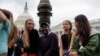 Swedish youth climate activist Greta Thunber, 16, sits on the side among other youth climate activists at a news conference about the Green New Deal hosted by U.S. Senator Ed Markey (D-MA) in front of the U.S. Capitol in Washington, Sept. 17, 2019.