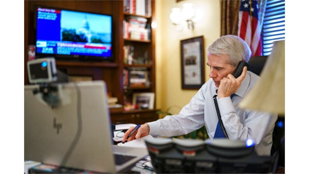 Sen. Rob Portman, R-Ohio, the top Republican negotiator on the bipartisan infrastructure bill, works from his office on Capitol Hill, Aug. 9, 2021.