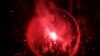 Catalan pro-independence demonstrators and Barcelona supporters light flares as they gather outside the Camp Nou stadium ahead of a Spanish La Liga soccer match between Barcelona and Real Madrid in Barcelona, Spain.