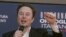 File - Tesla CEO Elon Musk in Rome, Dec. 16, 2023. A judge says Elon Musk must give up a compensation package awarded by Tesla's board of directors that is potentially worth more than $55 billion. 