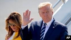 U.S President Donald Trump and first lady Melania Trump arrive in Biarritz, France, Aug. 24, 2019, for the G-7 summit. 
