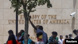 Haitians gather outside the U.S. Embassy after the assassination of President Jovenel Moise, in Port-au-Prince, Haiti, July 9, 2021.