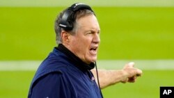 FILE - New England Patriots head coach Bill Belichick yells from the sideline during the second half of an NFL football game against the Los Angeles Rams in Inglewood, Calif., Dec. 10, 2020.