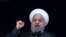 FILE - Iranian President Hassan Rouhani speaks during a ceremony celebrating the 40th anniversary of the Islamic Revolution, at the Azadi, Freedom, Square in Tehran, Feb. 11, 2019.