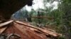 FILE - Rangers confiscate woods after a raid at an illegal logging site at Seulawah mountains in Aceh province, Indonesia, May 14, 2009.