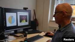 University of Copenhagen post-doctoral researcher   Jeppe Have Rasmussen shows however  spectrograms of pig calls are analysed connected  a machine  successful  Copenhagen, Denmark, October 22.