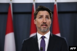 Canadian Prime Minister Justin Trudeau speaks to the press, Jan. 9, 2020, in Ottawa, Canada. He said Canada had intelligence from multiple sources indicating that a Ukrainian airliner that crashed near Tehran was mistakenly shot down by Iran.