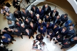 FILE - House Republicans speak to reporters after Deputy Assistant Defense Secretary Laura Cooper arrived to testify at a closed-door deposition as part of the impeachment inquiry into President Donald Trump, Oct. 23, 2019.