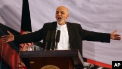 Afghan president-elect Ashraf Ghani Ahmadzai speaks in his first public appearance since being declared winner in the election runoff, in Kabul, Sept. 22, 2014.