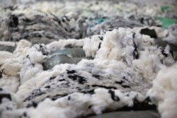 Dyed cotton is piled at a Huafu Fashion plant, as seen during a government organized trip for foreign journalists, in Aksu in western China's Xinjiang Uyghur Autonomous Region, April 20, 2021.