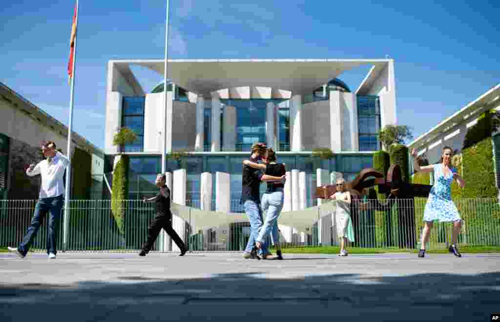 People dance in front of the Chancellery, office of German Chancellor Angela Merkel, in Berlin, on the occasion of the action day &#39;Save the world cultural heritage Tango Argentino in Germany.&#39;